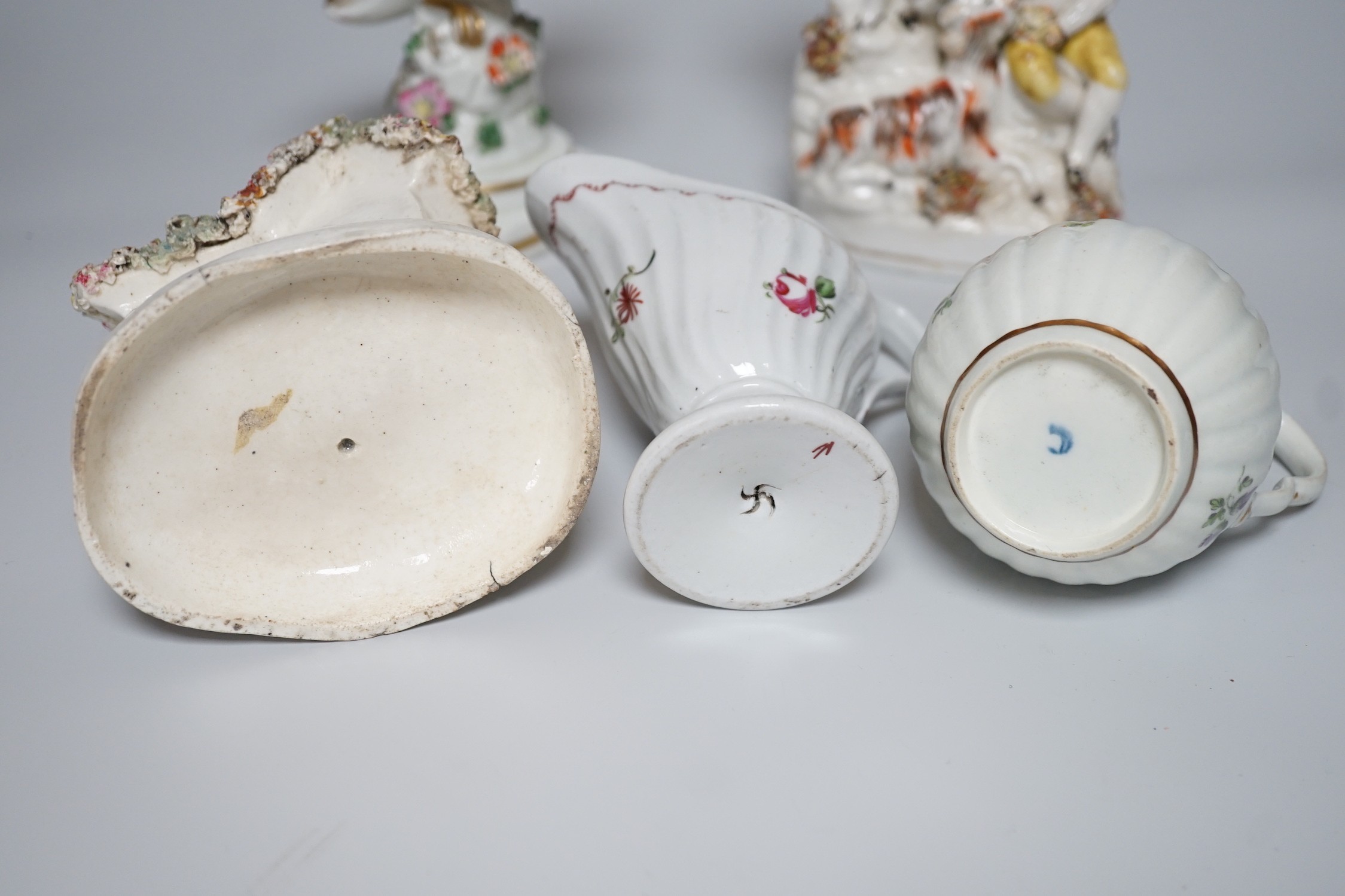 A Worcester milk jug, c.1780, a Newhall-type cream jug, c.1795, a Staffordshire porcelain model of an eagle, c.1830-40, 17cm high, and two Staffordshire porcellaneous models